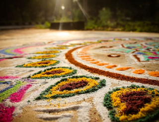 Traditional floor art to welcome guests with beauty.